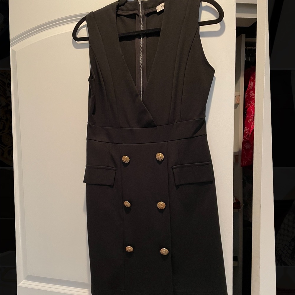 Black dress. Size 6. Never worn! Black with beautiful gold buttons.